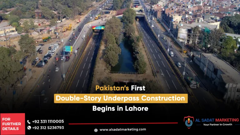 a road wiht double story under pass in lahore surondad with green trees and buildings